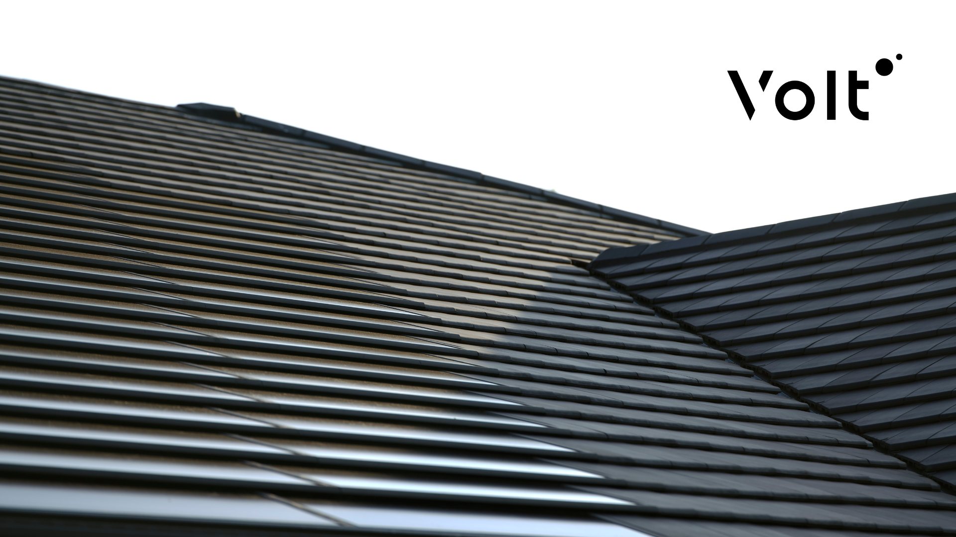 Close-up of Volt solar roof tiles on a dark tiled roof, showing a seamless, low-profile integrated solar roofing design.