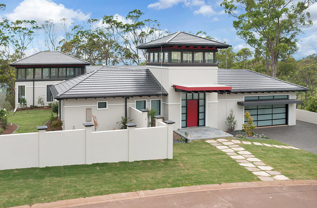 Contemporary home with tiled roofing completed by a roofer in Mayfield, featuring clean architectural lines, multiple roof pitches, and a high-quality modern finish.